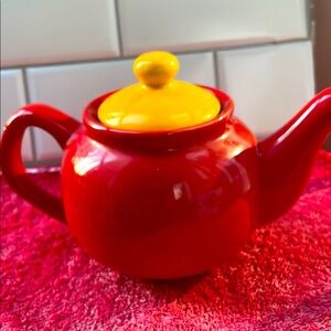 Red and Yellow Ceramic Teapot